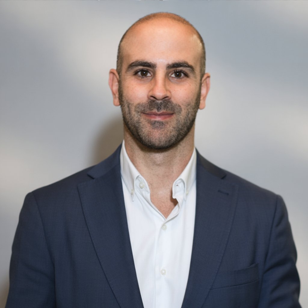Ittai Perez, Founder and CEO of Dynamic Reactions LLC, professional headshot showing confident technology leader in business attire